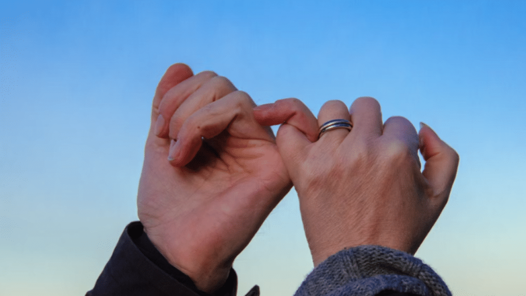 A couple doing the pinky promise 