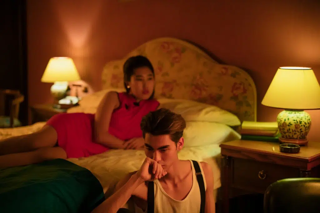 Woman in Pink Dress Lying on Bed