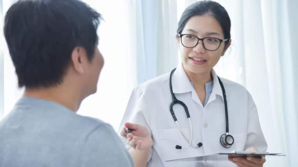 Man at medical checkup with doctor