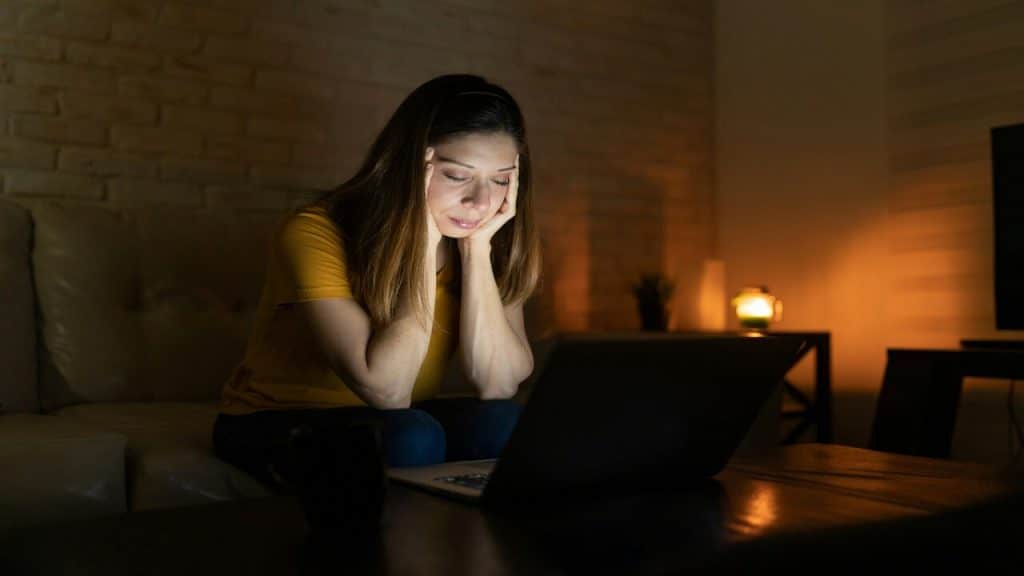 A woman looking sad at work