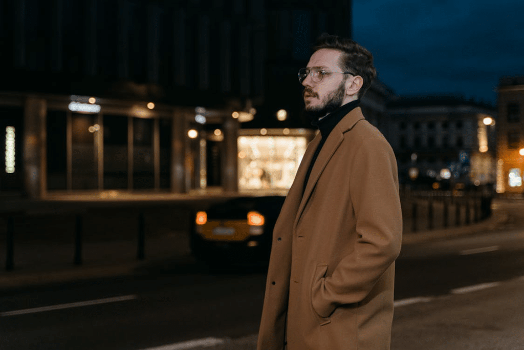 Man in Brown Coat Standing on the Street