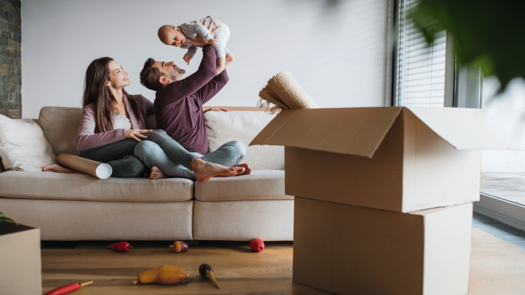 A couple moving into a new home with their baby