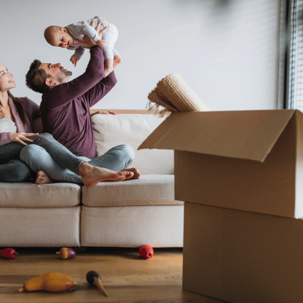 A couple moving into a new home with their baby