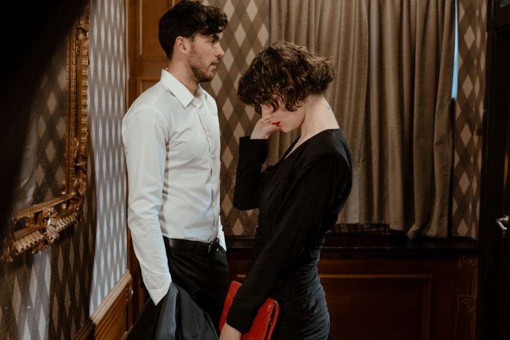 A Man and a Woman Standing Next to Each Other