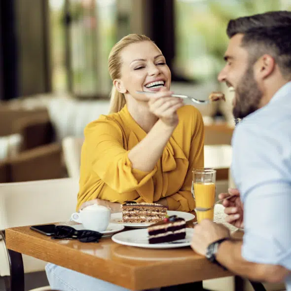 A woman feeding her husband