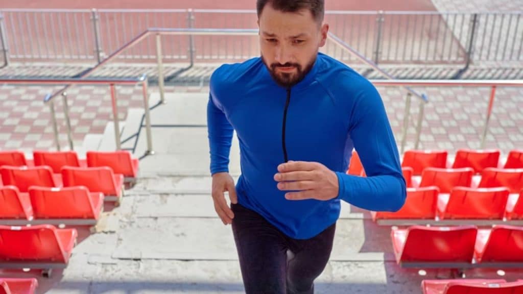 Man jogging outdoors with determination