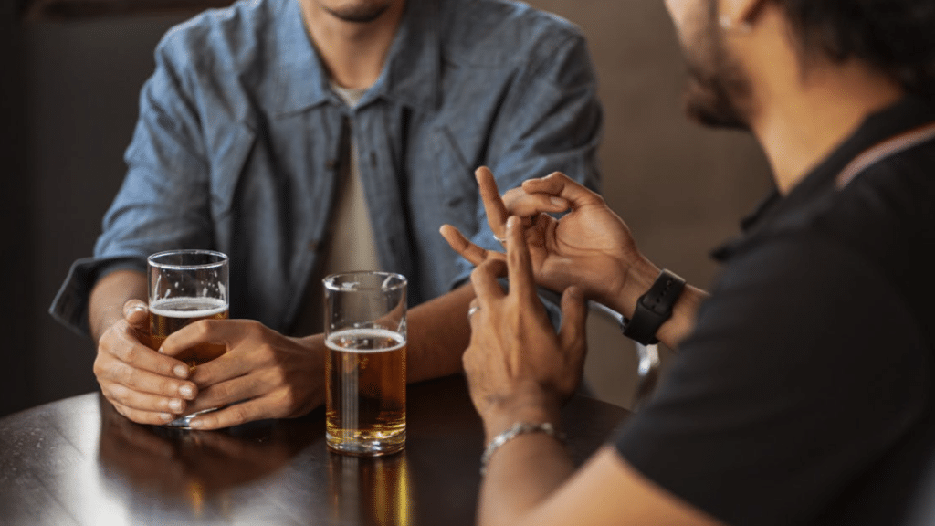 Male friends having beer together 