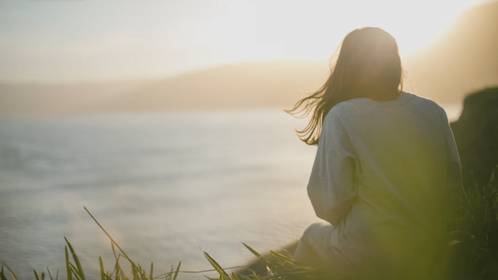 A woman watching the sunset