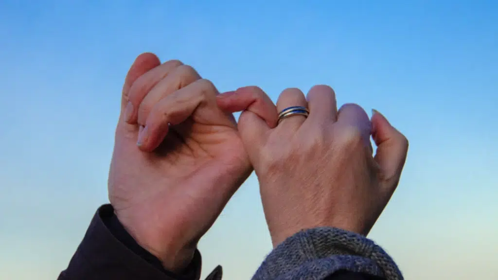 A couple doing the pinky promise