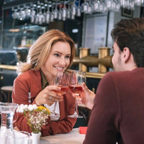 The couple is sharing a drink