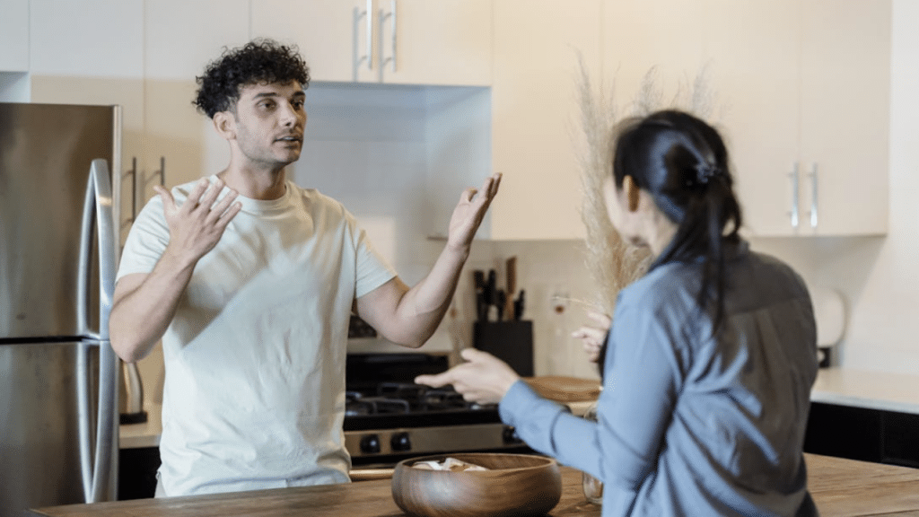 A couple quarreling in the kitchen