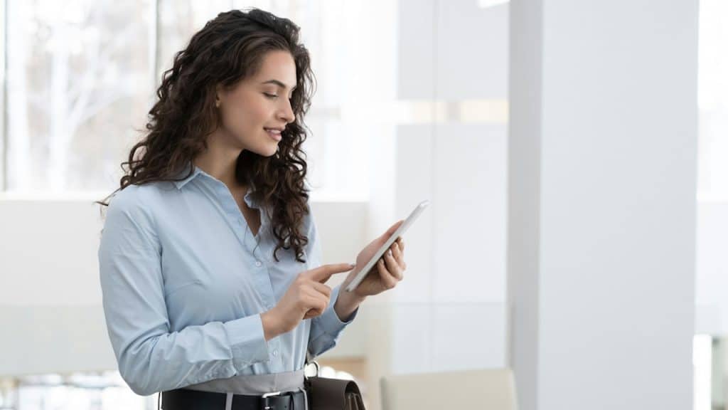 A successful woman using her smartphone.