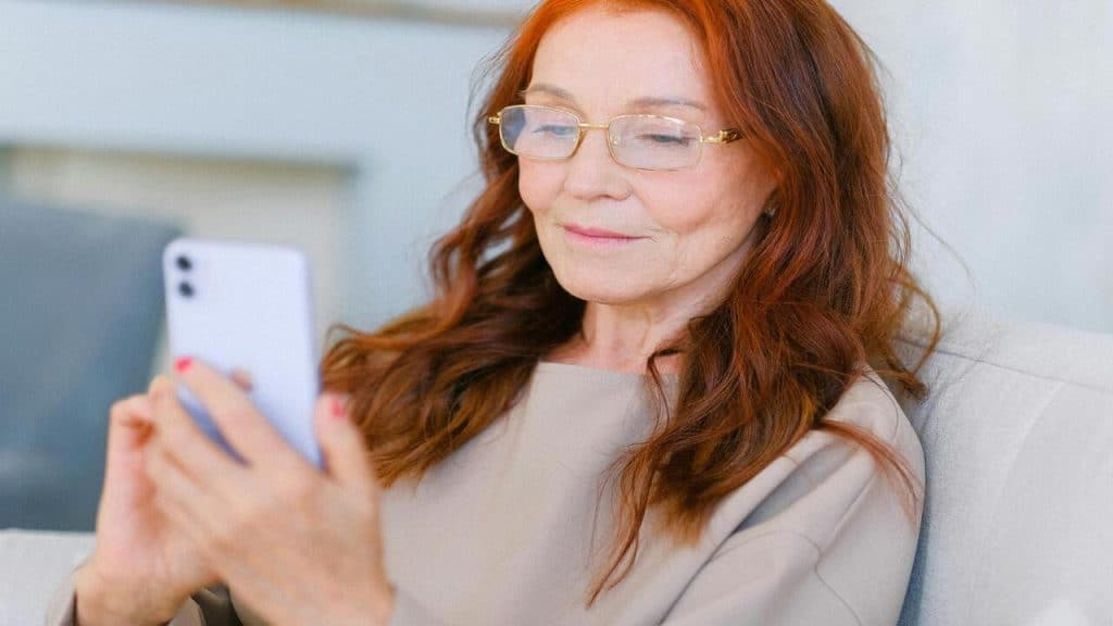 A woman texting by herself
