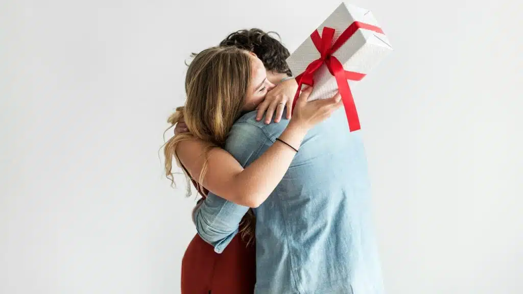 A man giving his wife a gift