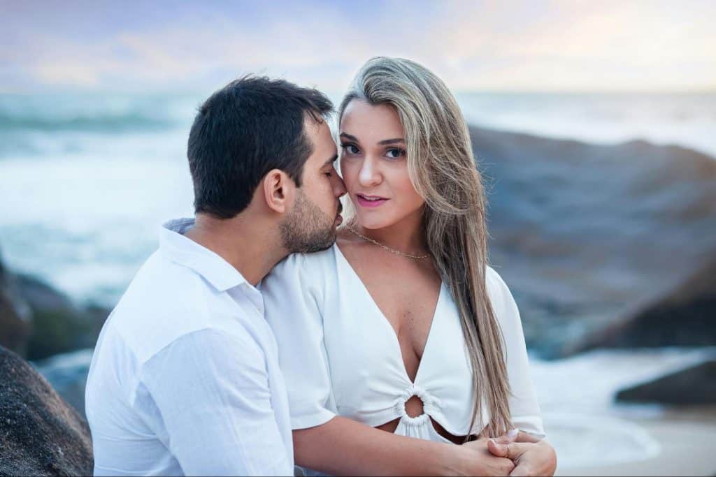 A man kissing a woman’s cheek