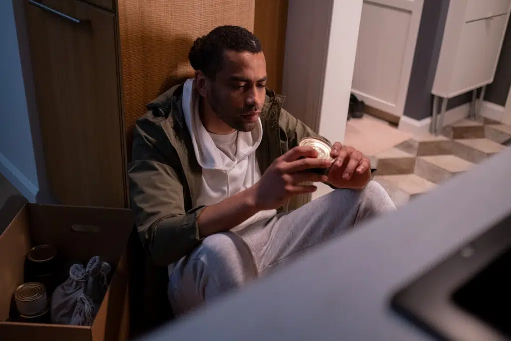 Man Looking at a Canned Food