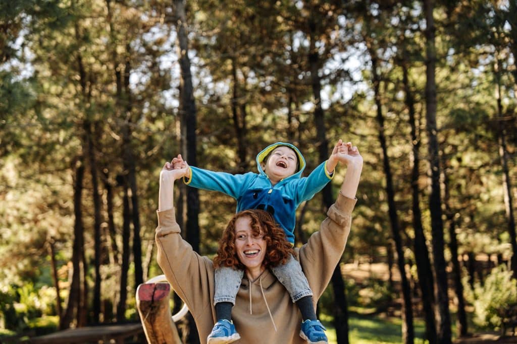 The mother and son are spending time together at the park.