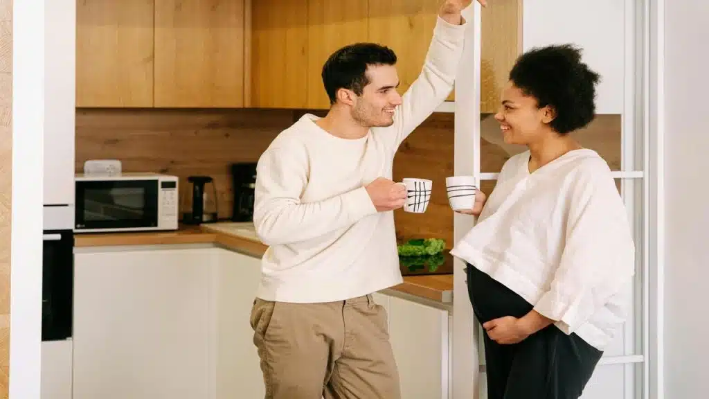 A couple talking in the kitchen