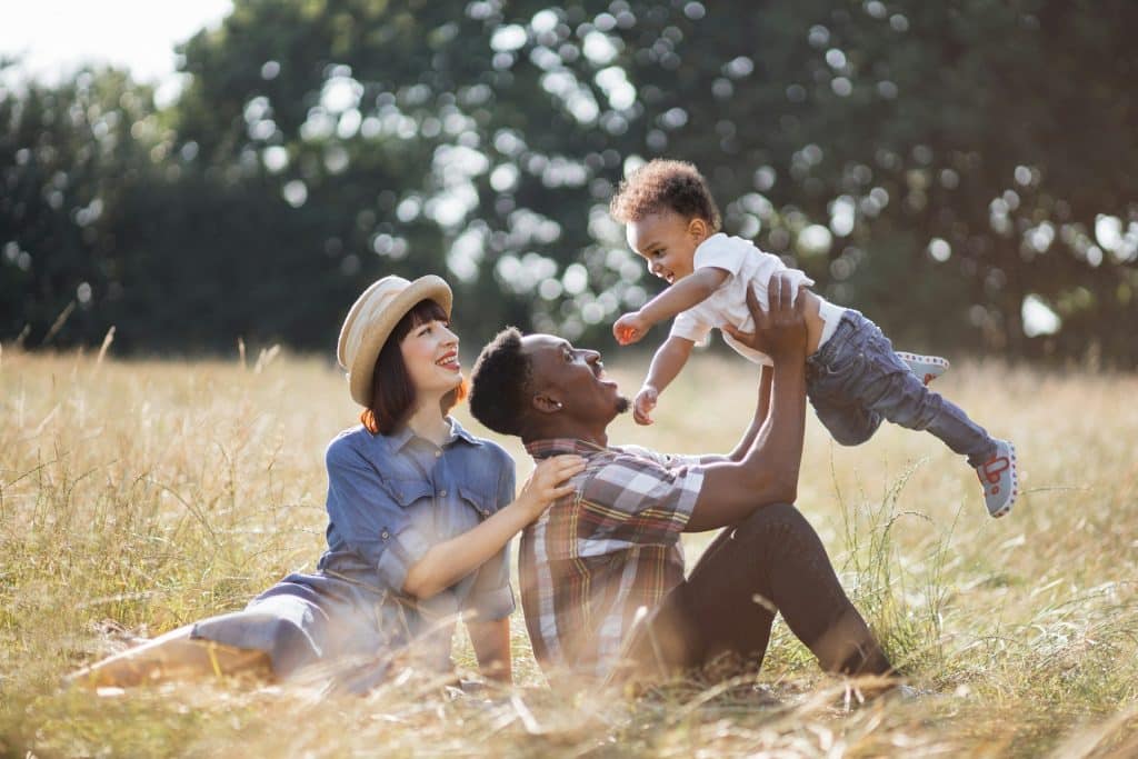 The young family is spending time outdoors.