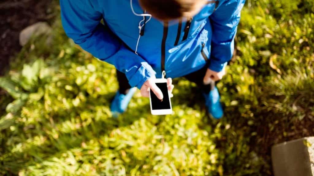 Man putting his phone down and taking a walk outdoors