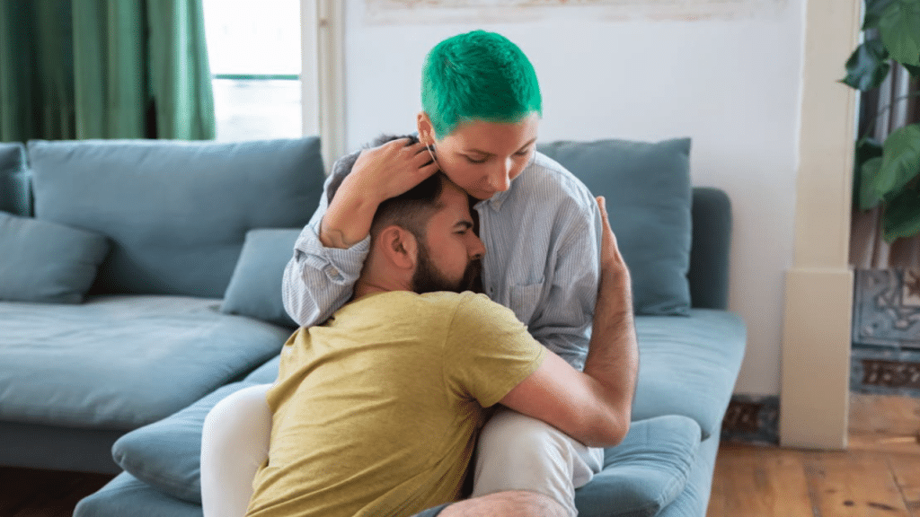 A couple hugging at home