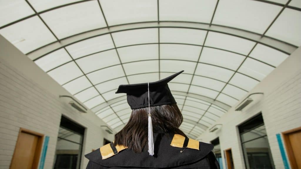 A woman celebrating her graduation alone
