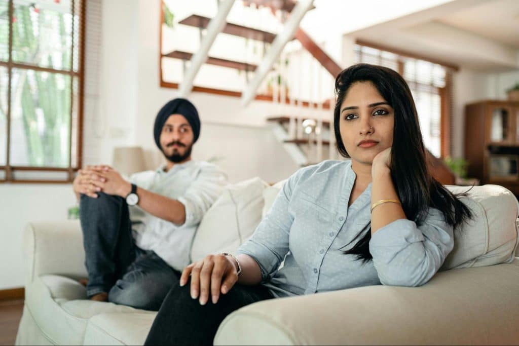A man and woman at the couch