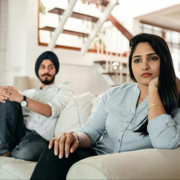 A man and woman at the couch
