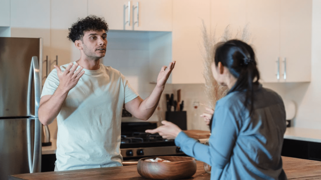 A couple arguing in the kitchen