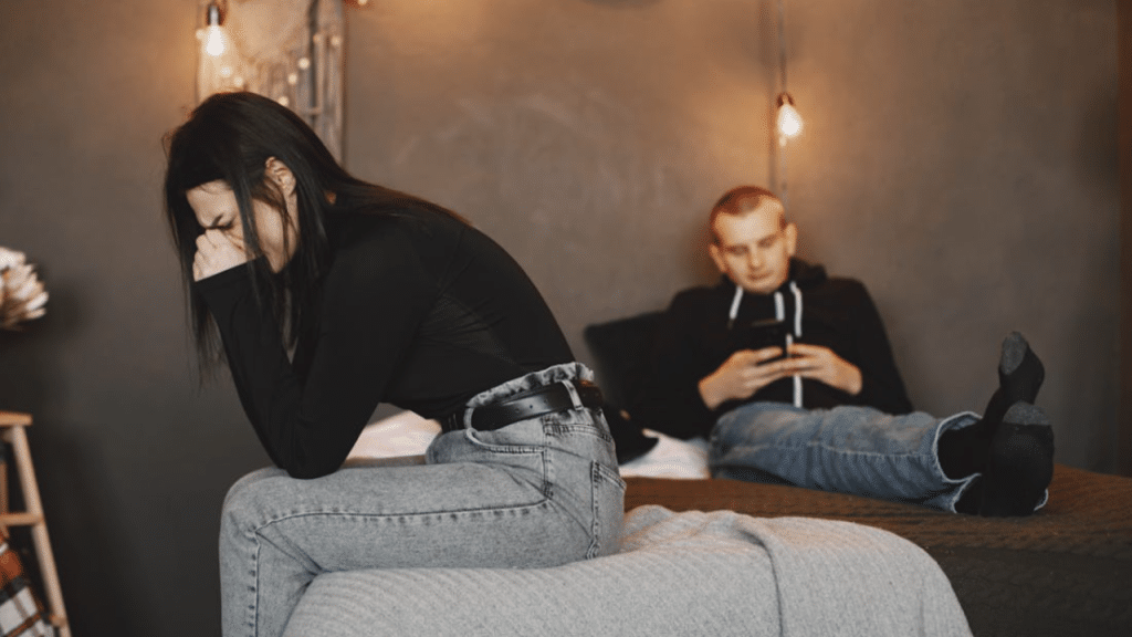 A couple looking sad at home