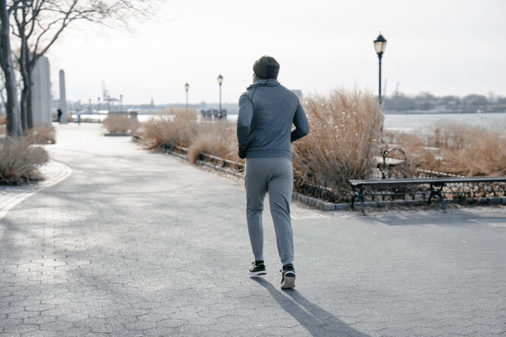 Man Wearing a Beanie Jogging at the Park