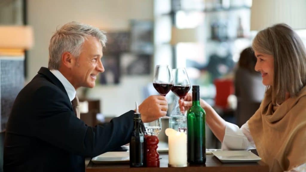 Mature man showing chivalry and kindness on a date