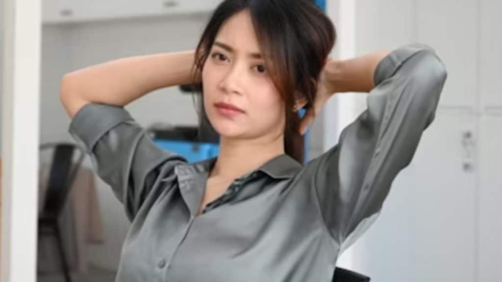 Woman sitting in silence with a blank expression