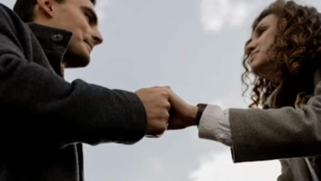 Couple holding hands after resolving a disagreement