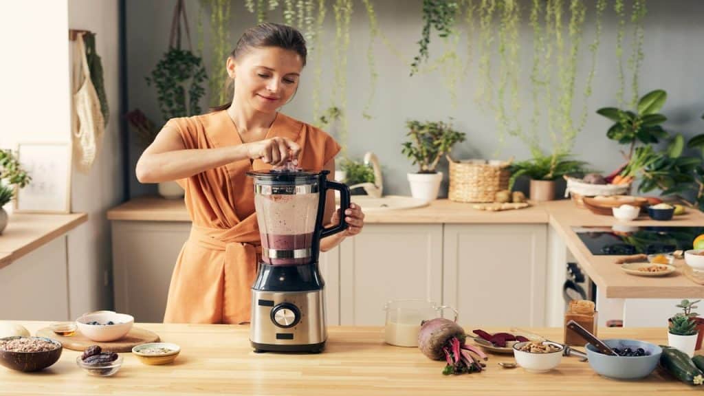 A woman making a smoothie