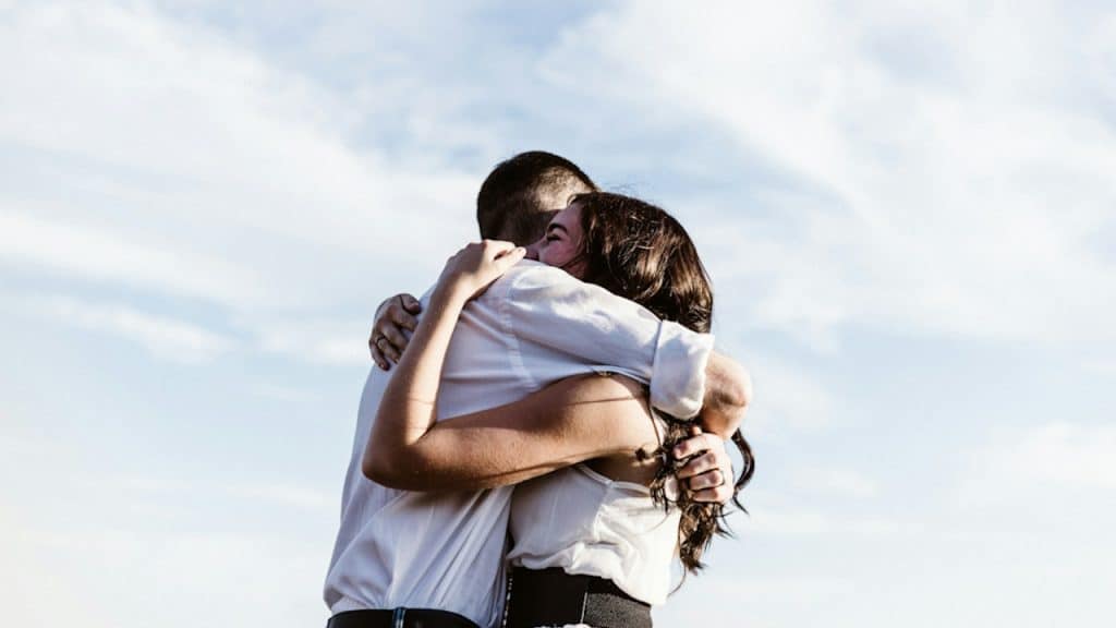 A couple hugging.