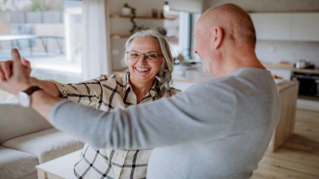 A couple dancing at home 