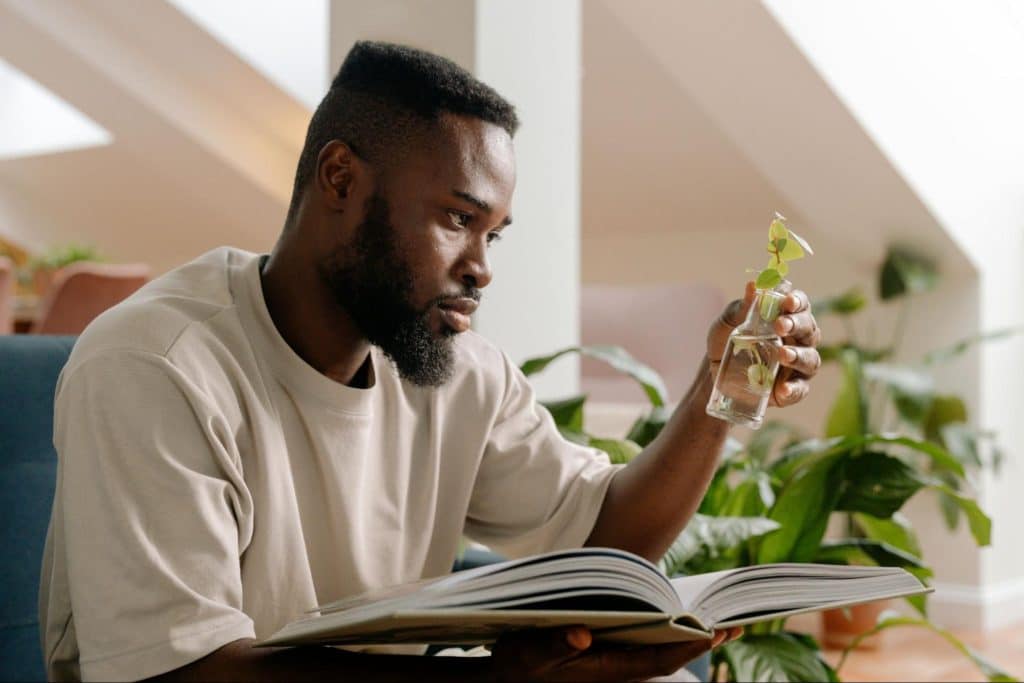 A man looking at the plant