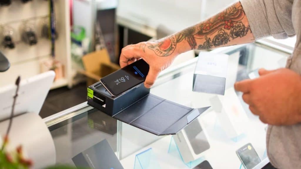 A man buying an expensive gadget impulsively