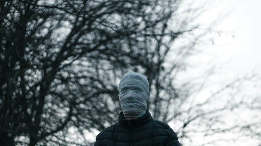 A man covered his face with a mask.