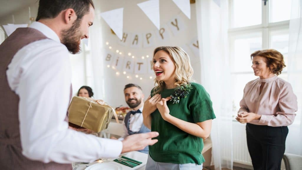 A woman being surprised for her birthday