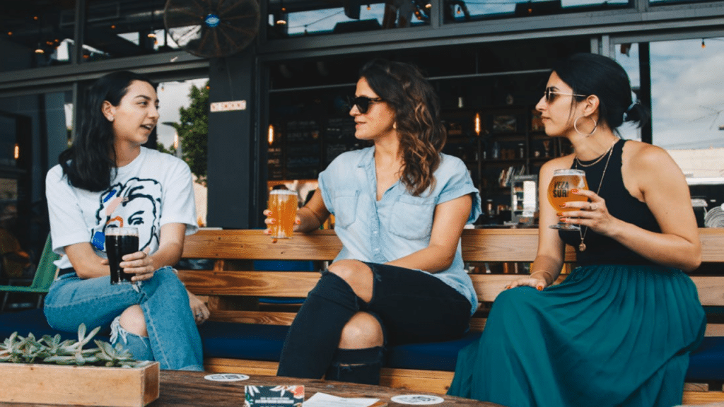 Friends talking over drinks