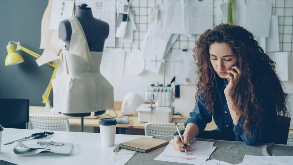 A woman on the phone while working