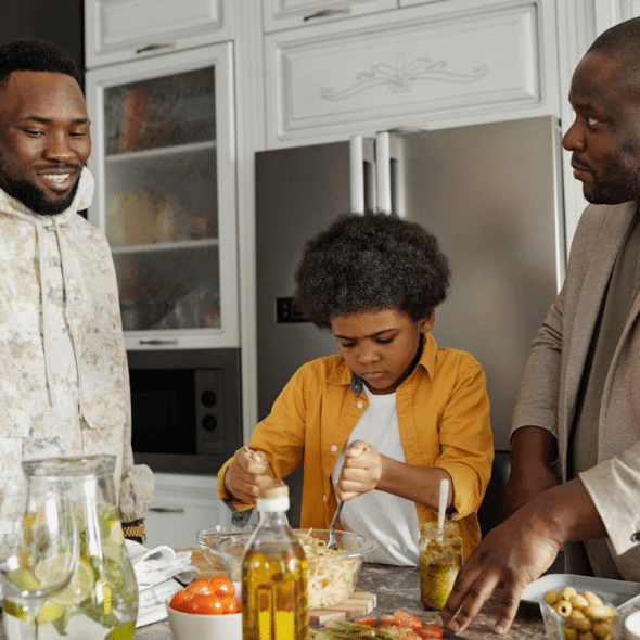 Men with a Child in a Kitchen