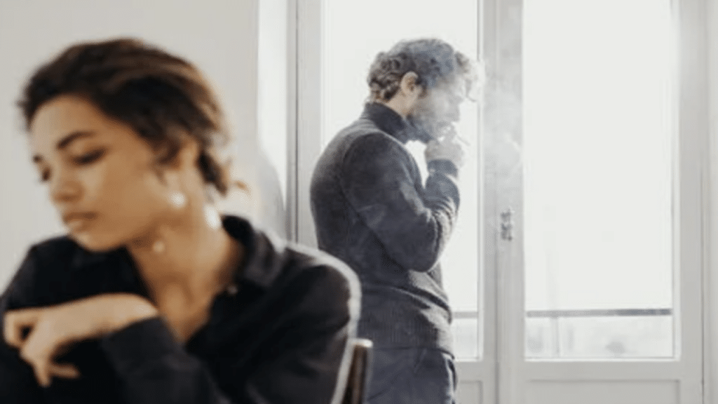A couple ignoring each other at home