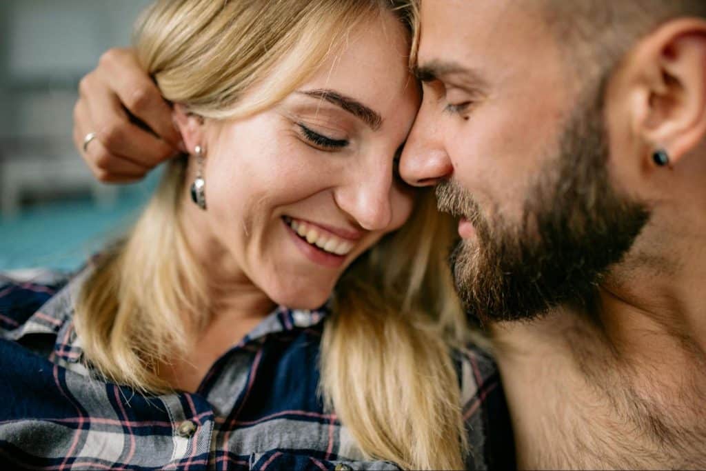 A man and woman close together 