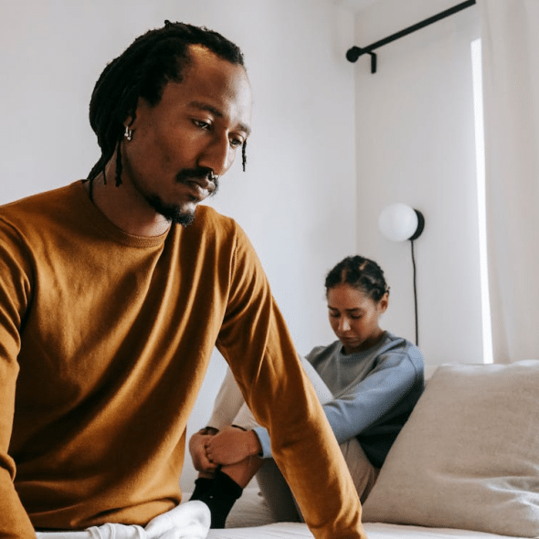 Upset black couple during dispute in bedroom