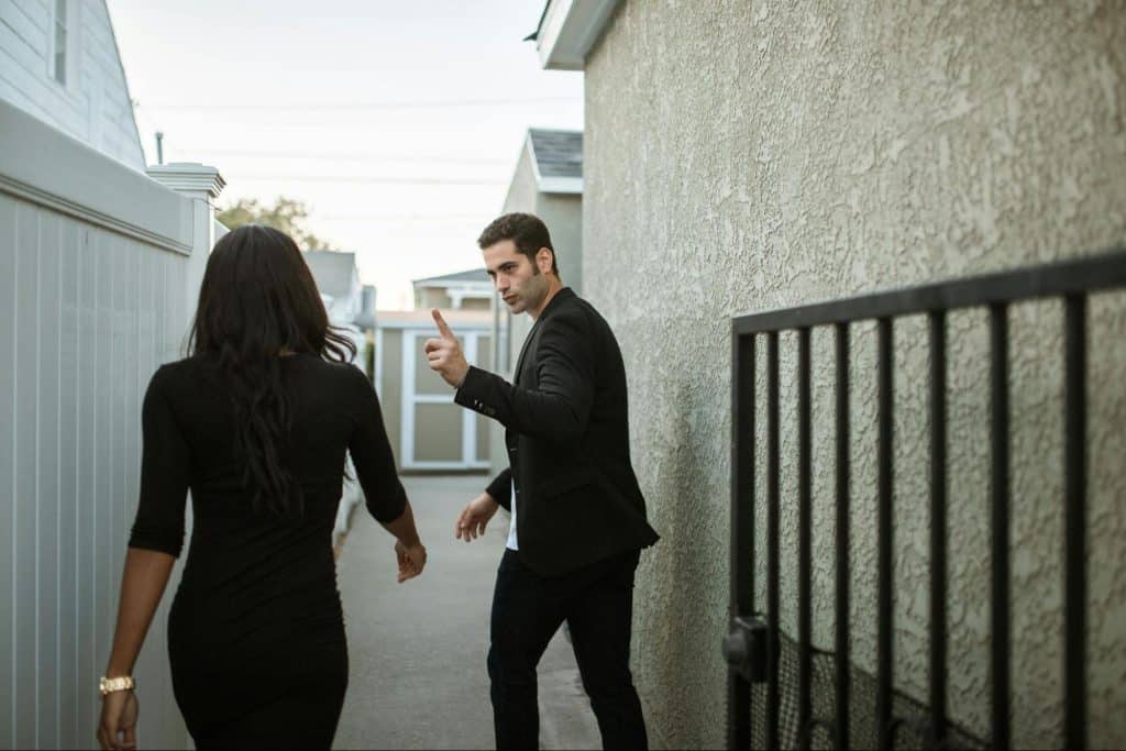 A man saying something to woman