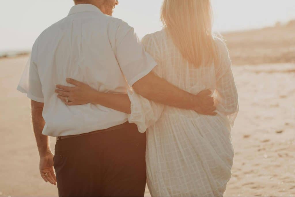 A man and woman embracing each other