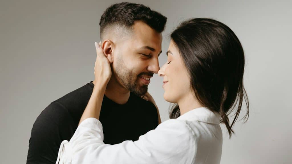 A man and a woman embracing each other.